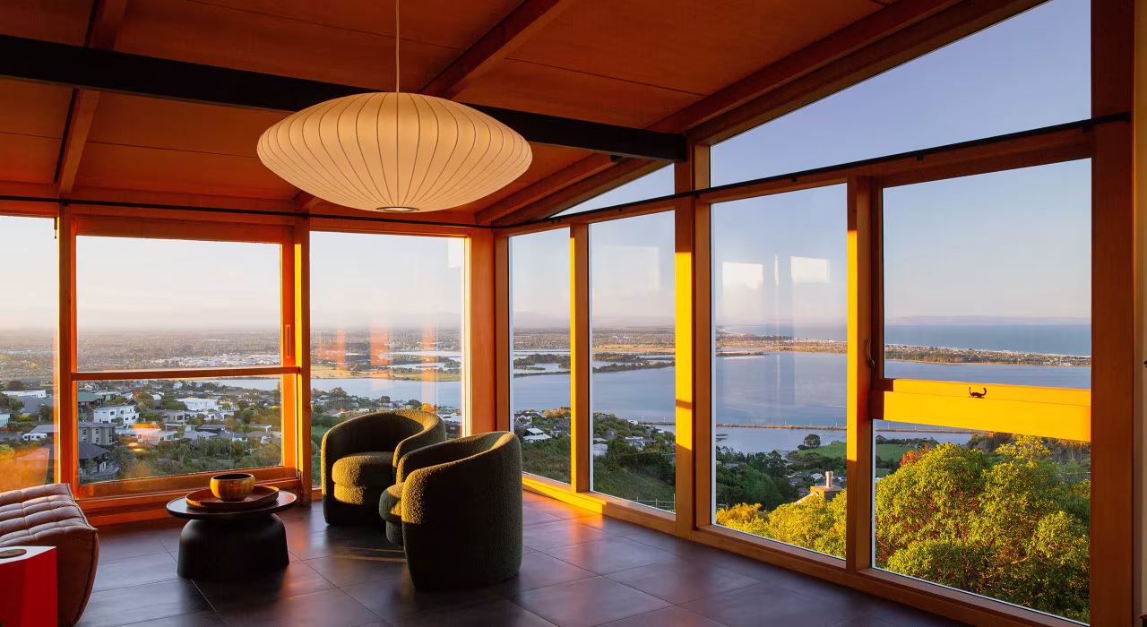 <img alt="Living area with floor-to-ceiling timber-framed glazing, pendant light and sweeping views over the estuary and beyond." src="/images/s/i/t/e/-/site-architects-interior-architecture-modernist4-af73a9b5.webp" width="2560" height="1707" />