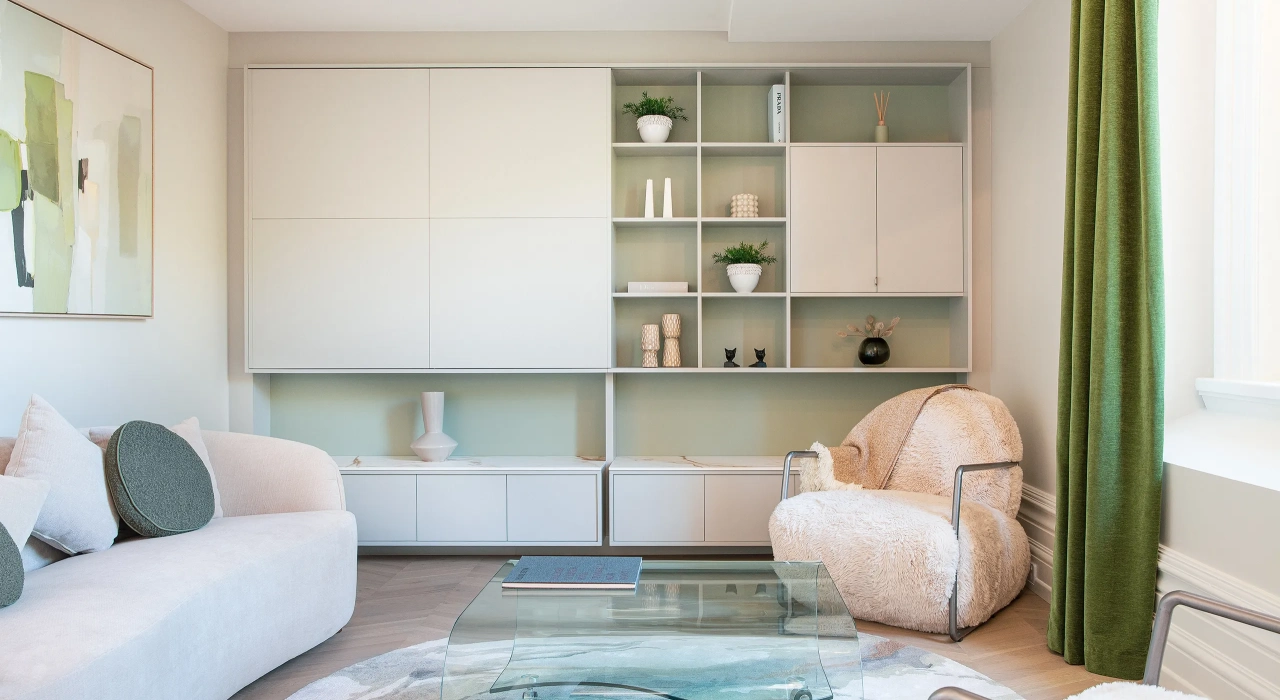 <img alt="Light-filled sitting room with soft furnishings, sage green shelving and generous glazing connecting to city views." src="/images/s/i/t/e/-/site-architecture-suite-17-ogb-interior-architecture10-fa48e91c.webp?description" width="2560" height="1707" />