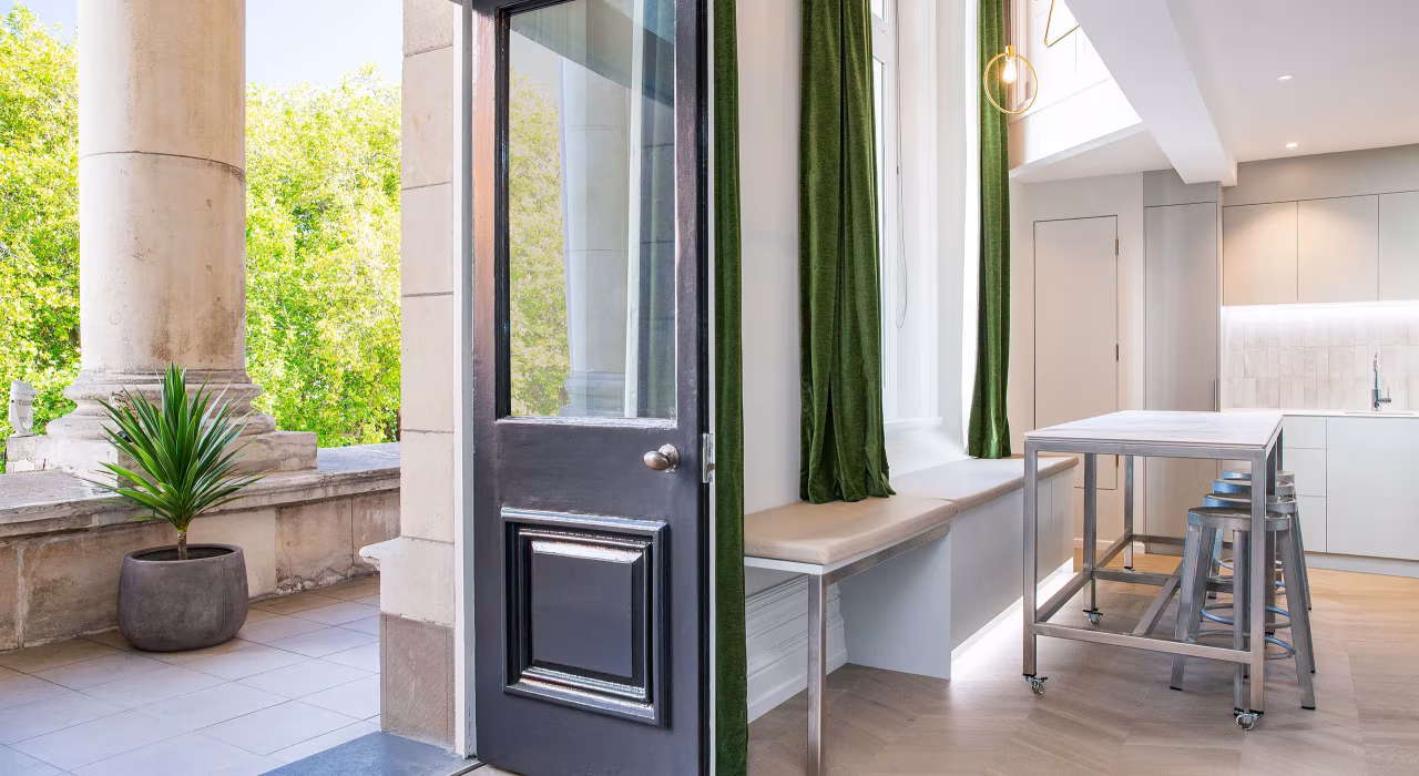<img alt="Terrace entry with tall dark door, white-framed sash windows and Christchurch's Cathedral Square visible beyond." src="/images/s/i/t/e/-/site-architecture-suite-17-ogb-interior-architecture2-6c2ef647.webp" width="2560" height="1707" />
