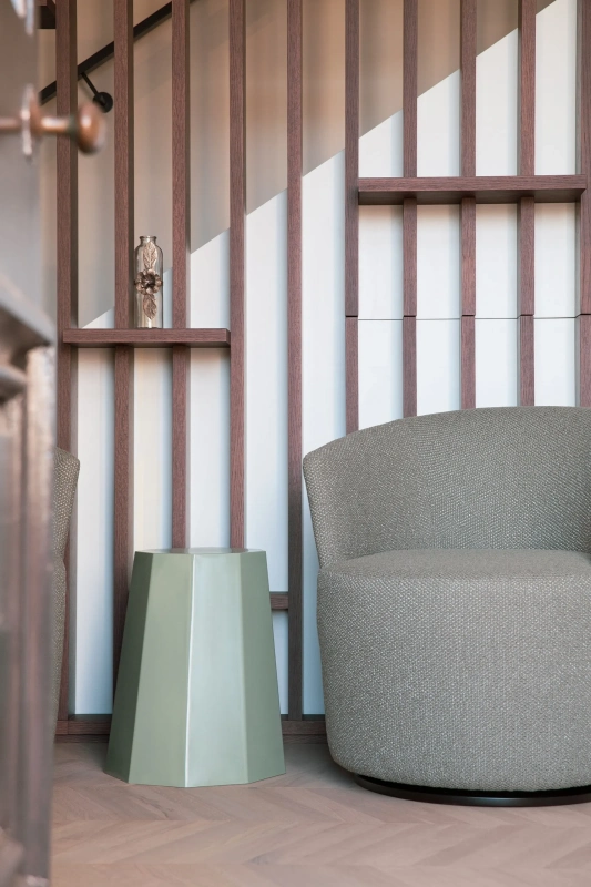 <img alt="Quiet reading nook with upholstered chairs and timber slat screen, soft light filtering through." src="/images/s/i/t/e/-/site-architecture-suite-17-ogb-interior-architecture5-c8da53b1.webp?description" width="1706" height="2560" />